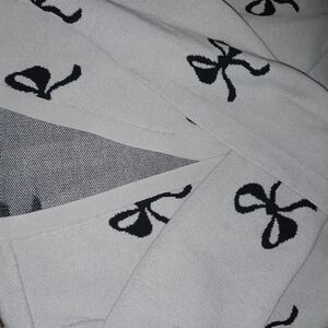 Gray Sweater with Black Bow Pattern